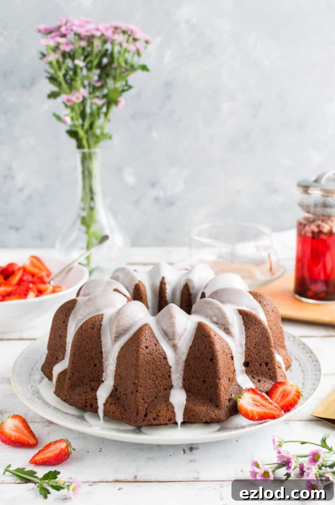Vegan Ginger Bundt with Zesty Lime Drizzle and Sweet Strawberries 3 Vegan gingerbread bundt cake with a lime glaze and macerated strawberries served with tea