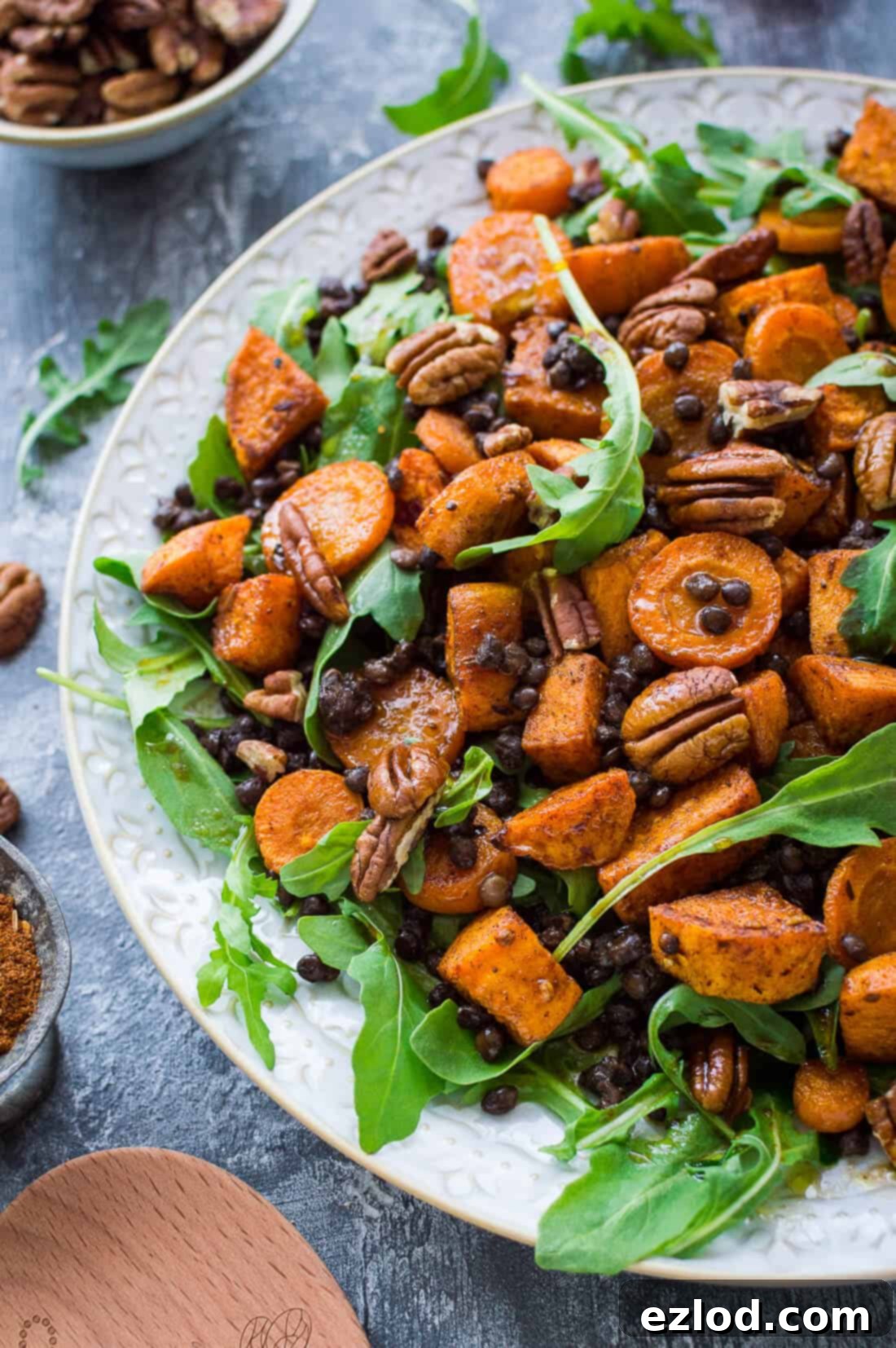 Wholesome Roasted Sweet Potato and Lentil Arugula Bowl 6 Side shot of roasted sweet potato, puy lentil, rocket (arugula) and pecan salad with pomegranate molasses dressing