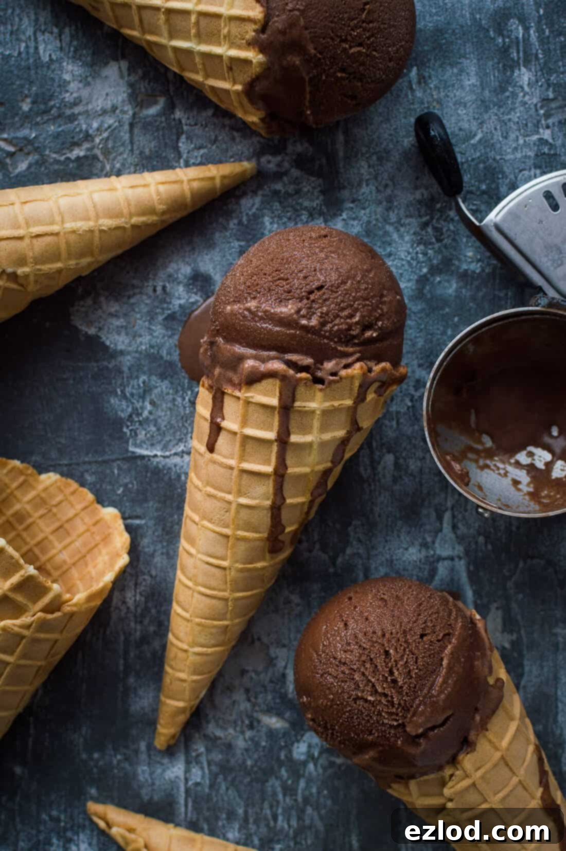 Vegan Chocolate Coconut Sorbet 4 Cones filled with vegan chocolate coconut sorbet, presented beautifully on a grey background.