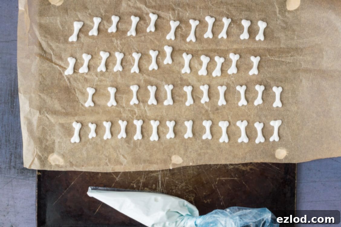 Plant-Based Graveyard Halloween Treats 9 Step 4 - piping the royal icing bones