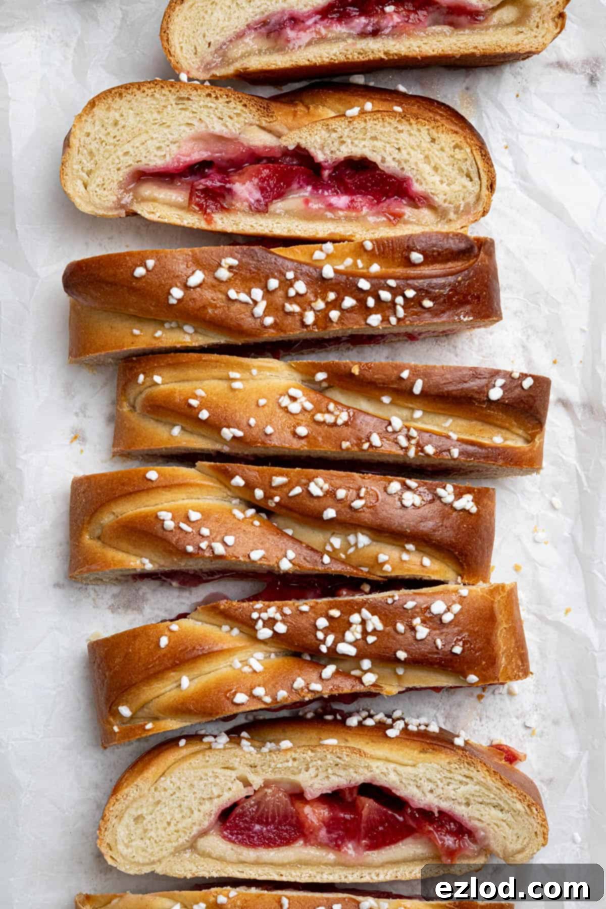 Vegan Plum Marzipan Delight 15 Slices of vegan plum and marzipan bread, some turned on their side.