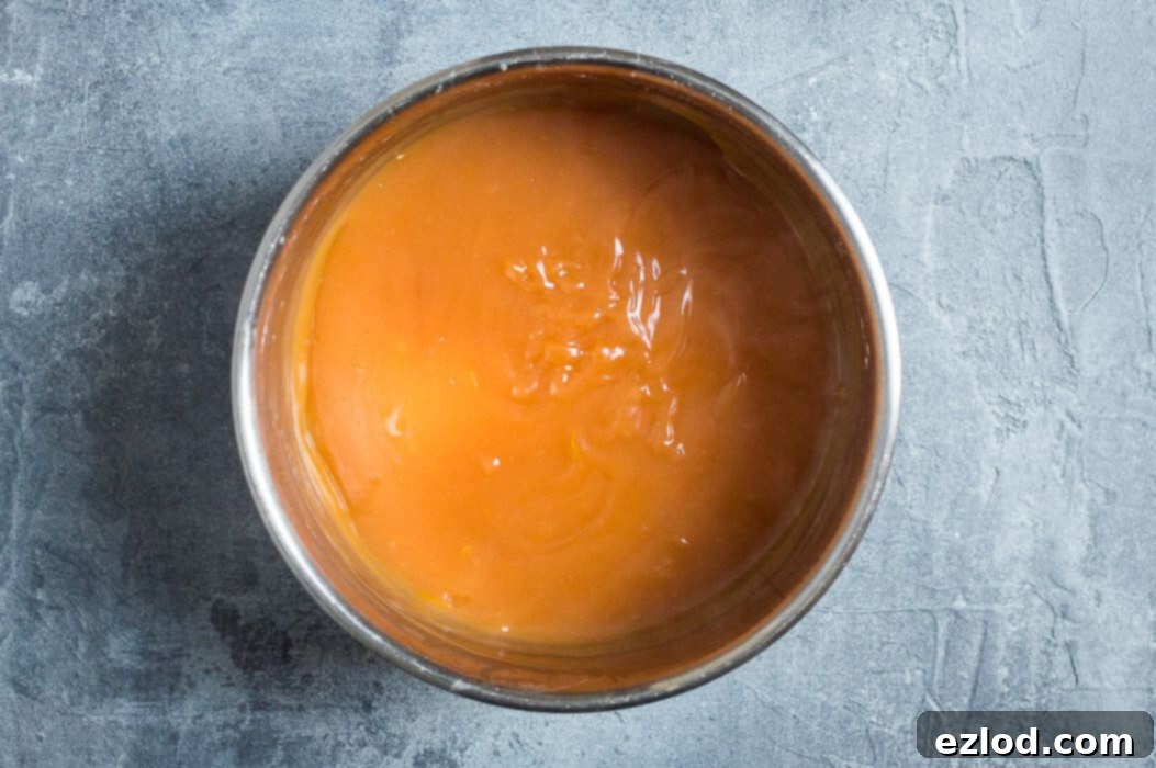 Luscious Vegan Blood Orange Curd 6 Step 2: Cooking the vegan blood orange curd mixture over medium-low heat, stirring until thick.