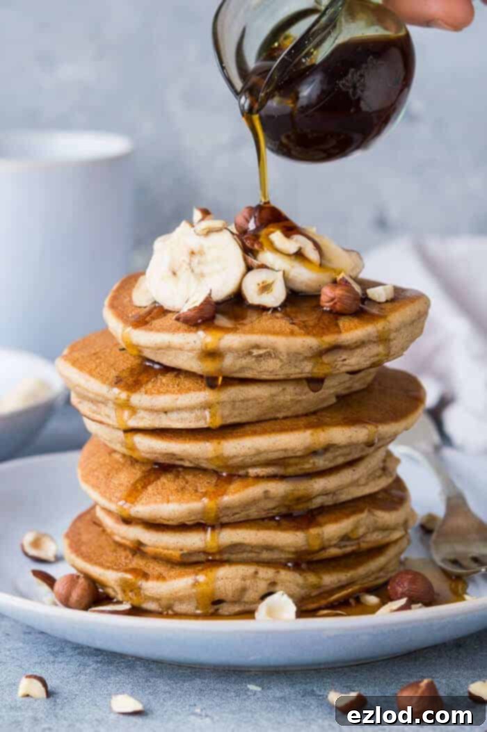 Pillowy Plant-Based Banana Pancakes 2 Fluffy vegan banana pancakes - these American style vegan pancakes are easy to make, super fluffy and perfect for breakfast or brunch. #vegan #pancakes #bananapancakes #veganpancakes