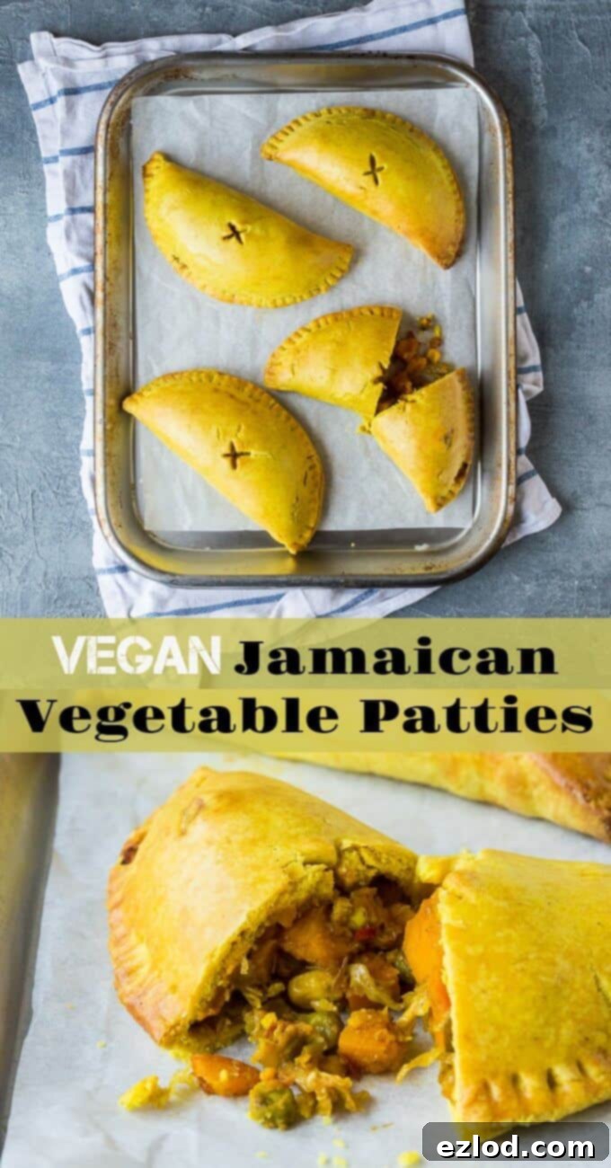 Delicious homemade Vegan Jamaican Vegetable Patties – spiced, Caribbean-style vegan pasties that are full of flavor and make a great snack or light meal. Eggless and dairy-free for a healthy plant-based option. #veganmeals #veganbaking #meatfree #plantbasedfood Overhead view of several vegan Jamaican vegetable patties neatly arranged on a silver baking tray, showing their golden tops.