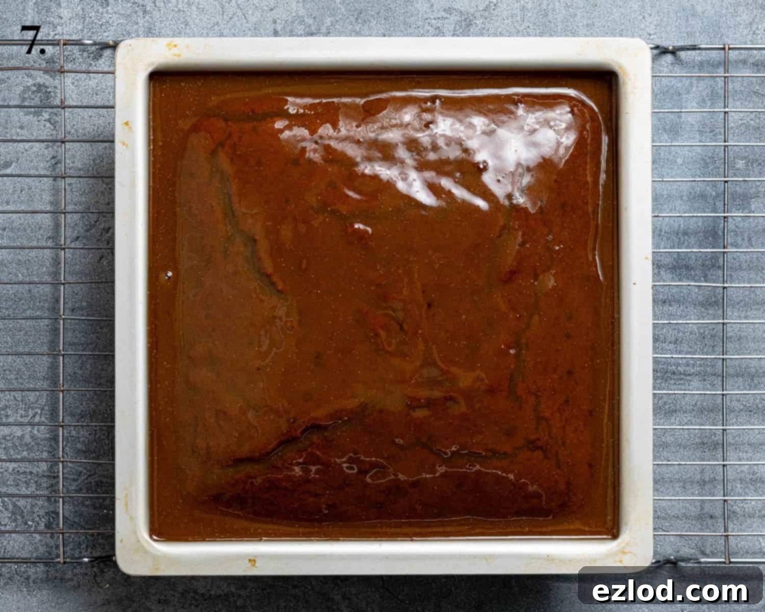 Spiced Pumpkin Sticky Toffee Pudding 11 Step 7: The freshly baked cake generously topped with about half of the warm, glossy toffee sauce, soaking into its porous surface.