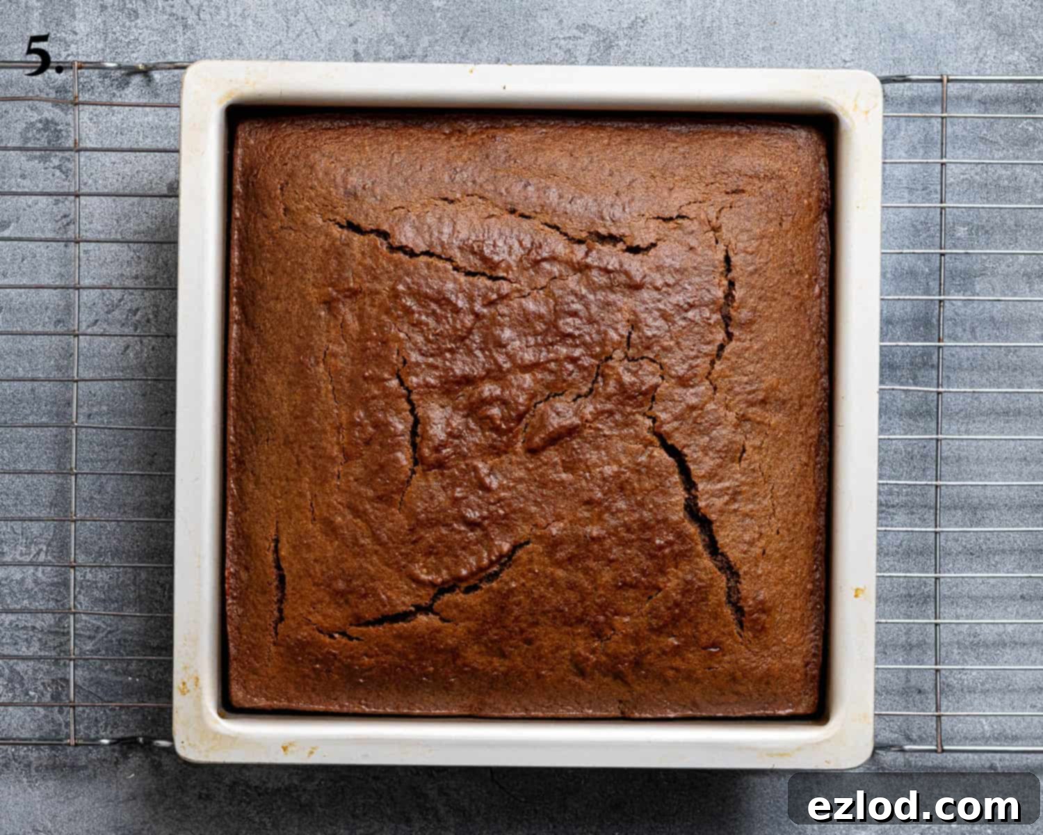 Spiced Pumpkin Sticky Toffee Pudding 9 Step 5: The perfectly baked pumpkin sticky toffee pudding, golden brown and risen in its tin, just out of the oven.