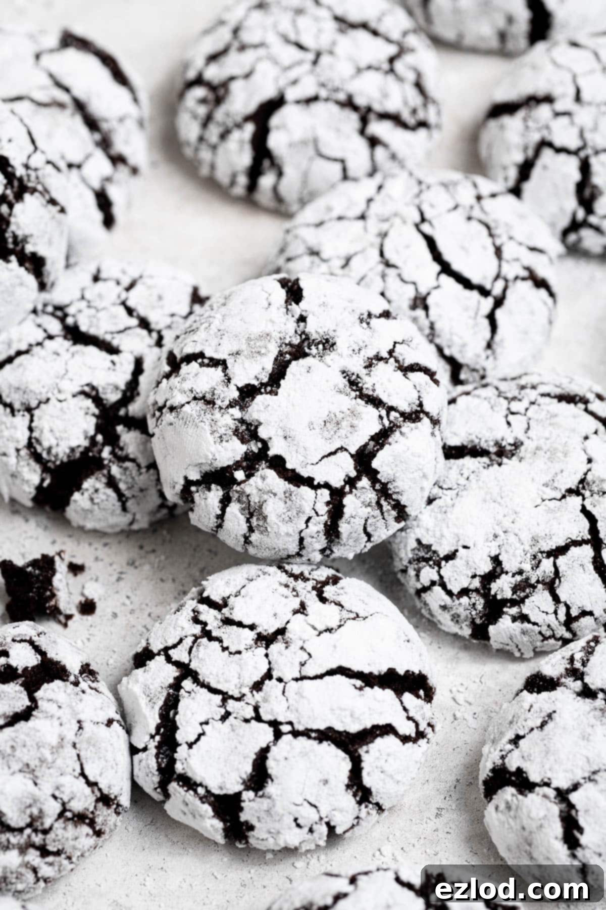 Vegan chocolate crinkle cookies on a white background.