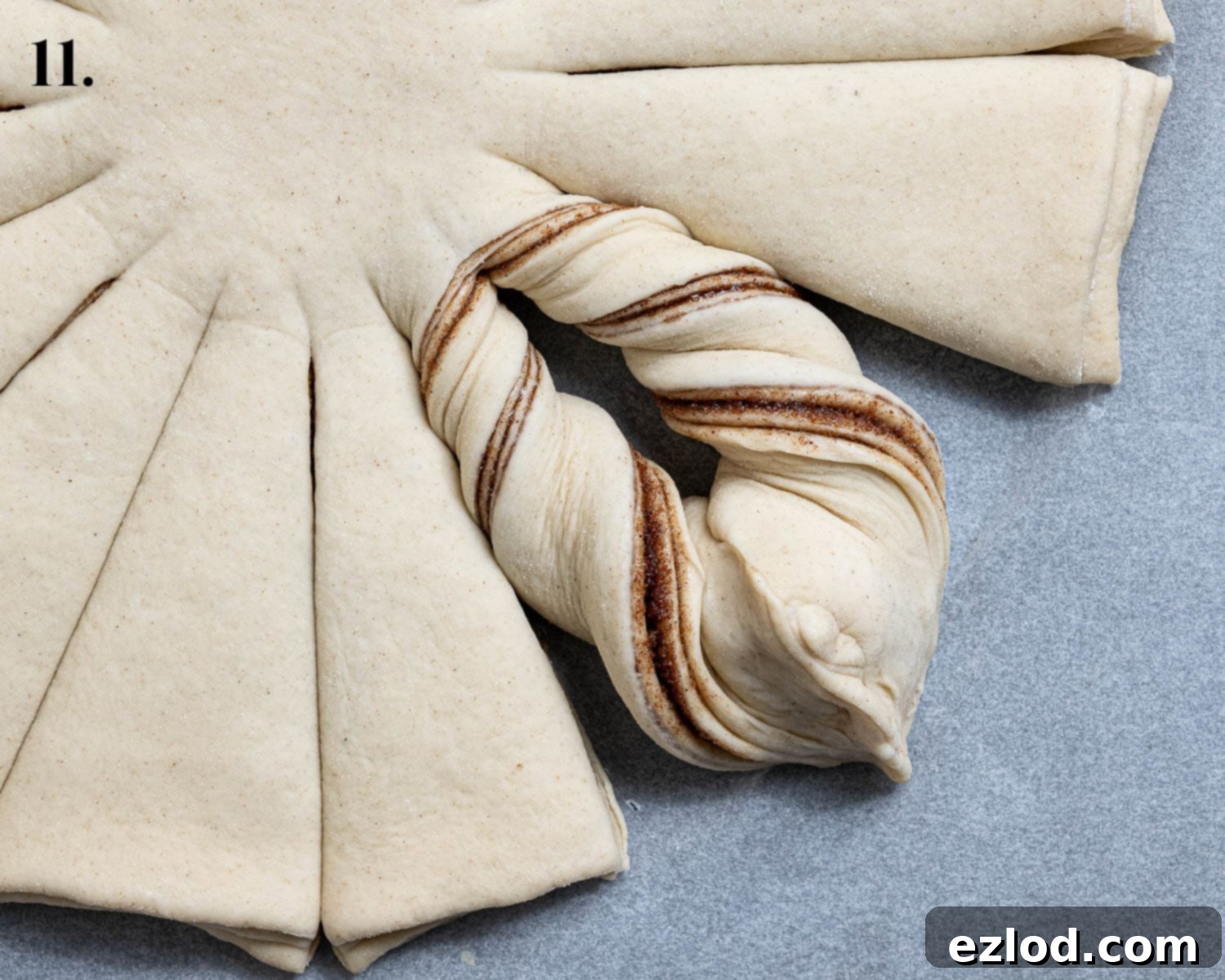 Vegan Cinnamon Star Bread 15 Step 11, pinching the twists together.