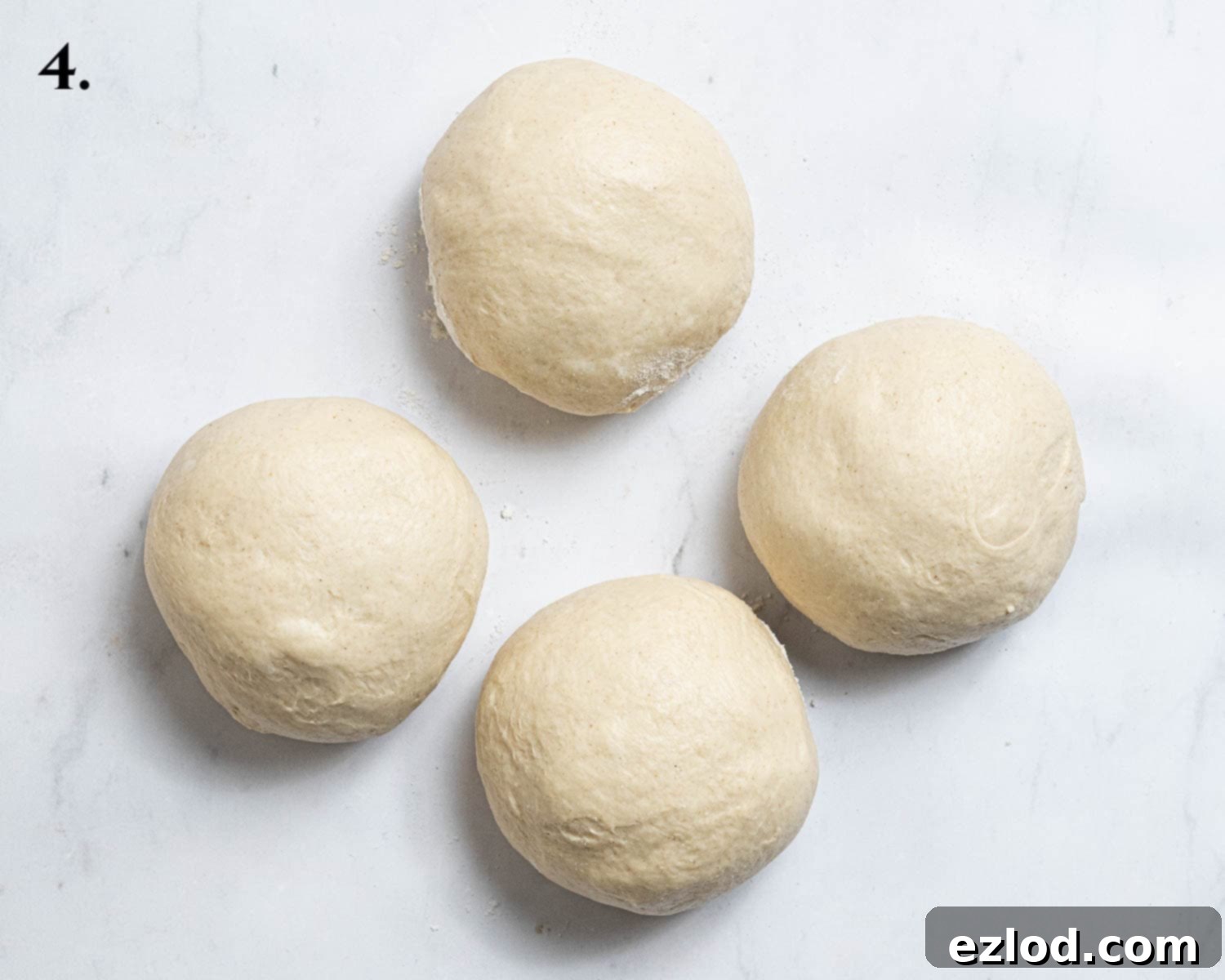 Vegan Cinnamon Star Bread 8 Step 4, the dough divided into 4 balls.