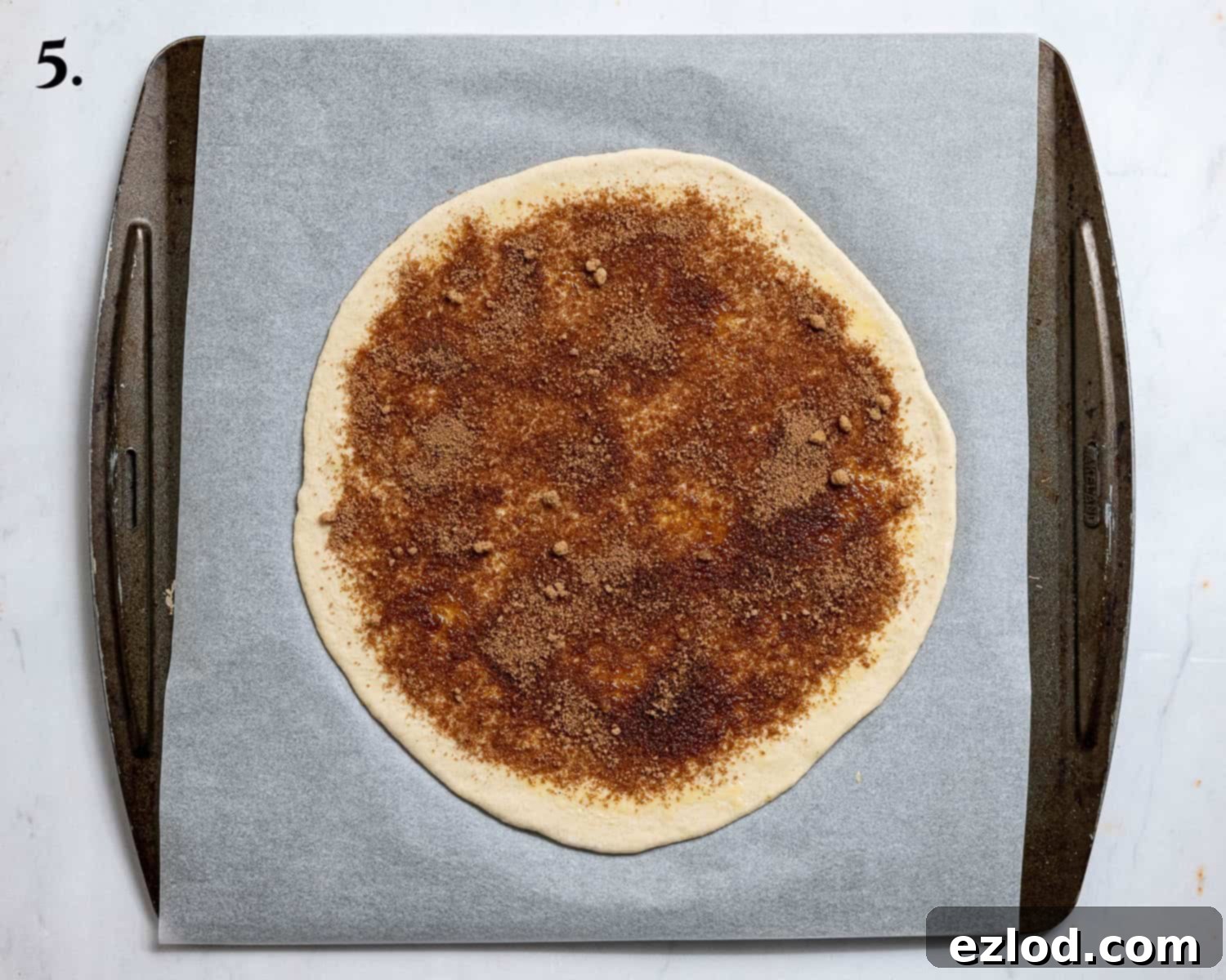 Vegan Cinnamon Star Bread 9 Step 5, the disc of dough topped with cinnamon sugar.
