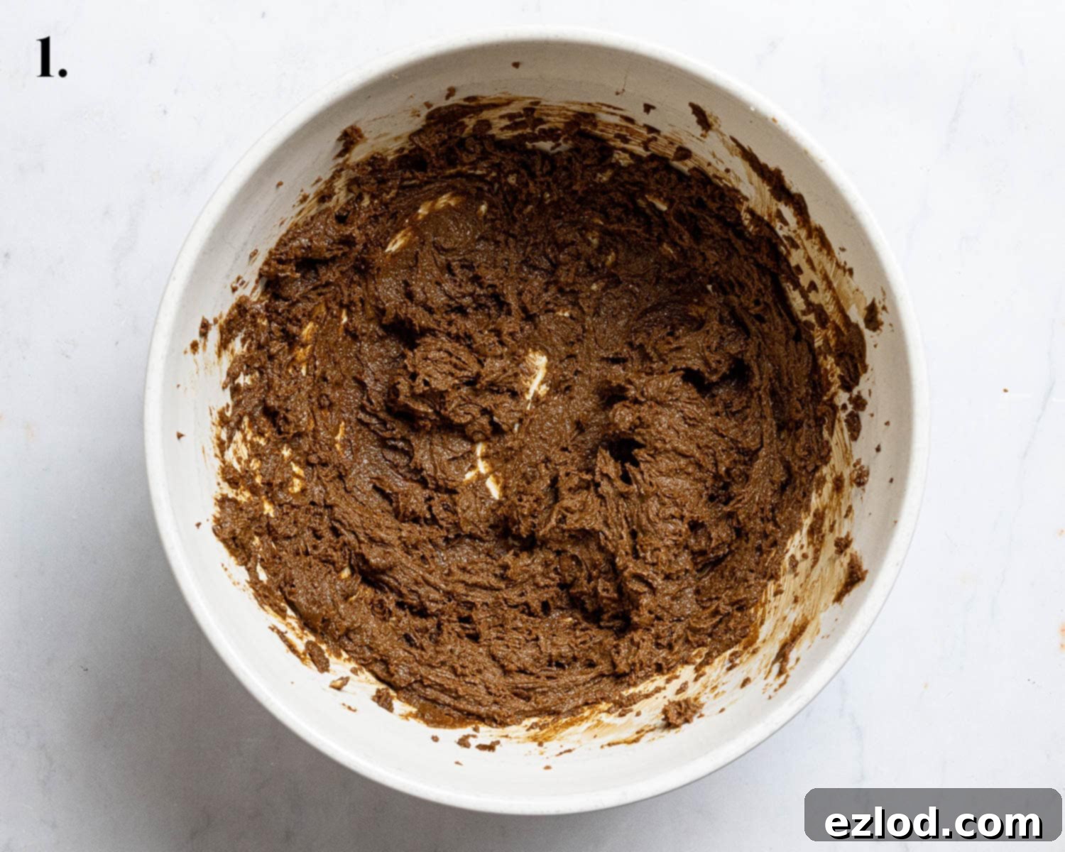 Step 1: The delightful combination of whisked butter, treacle, and sugar.