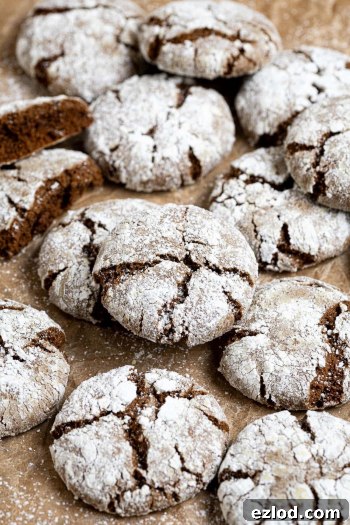 Vegan gingerbread crinkle cookies on a sheet of baking paper.