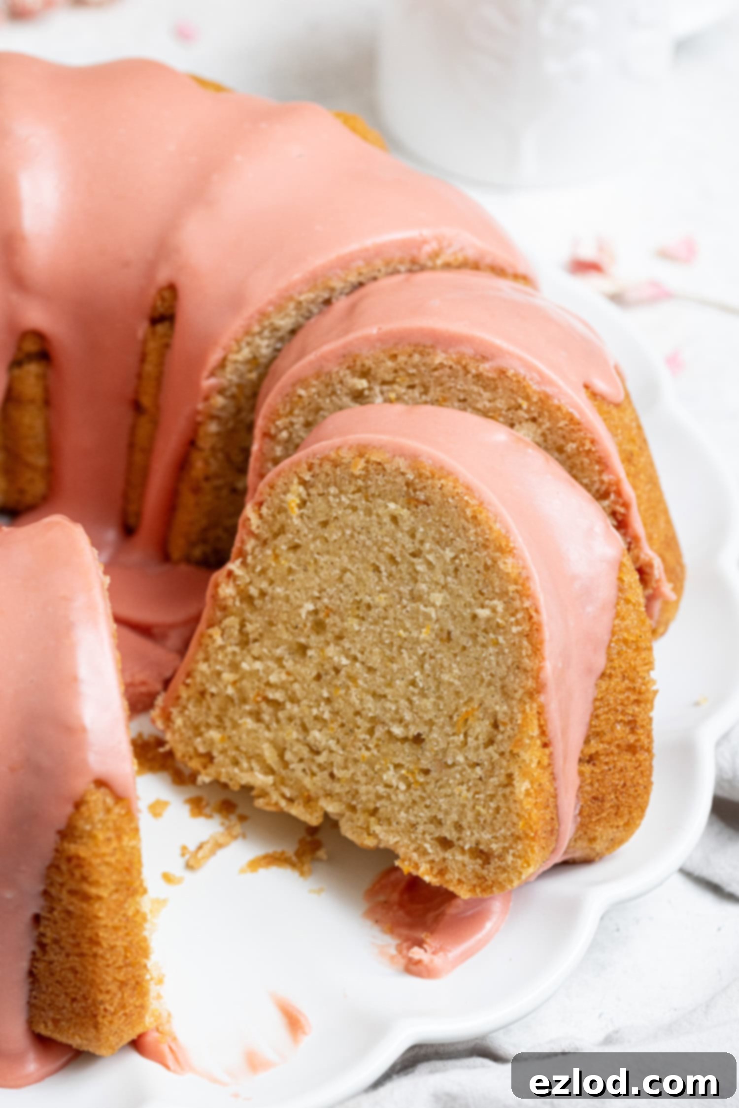 Close up of a slice of vegan blood orange olive oil bundt cake.