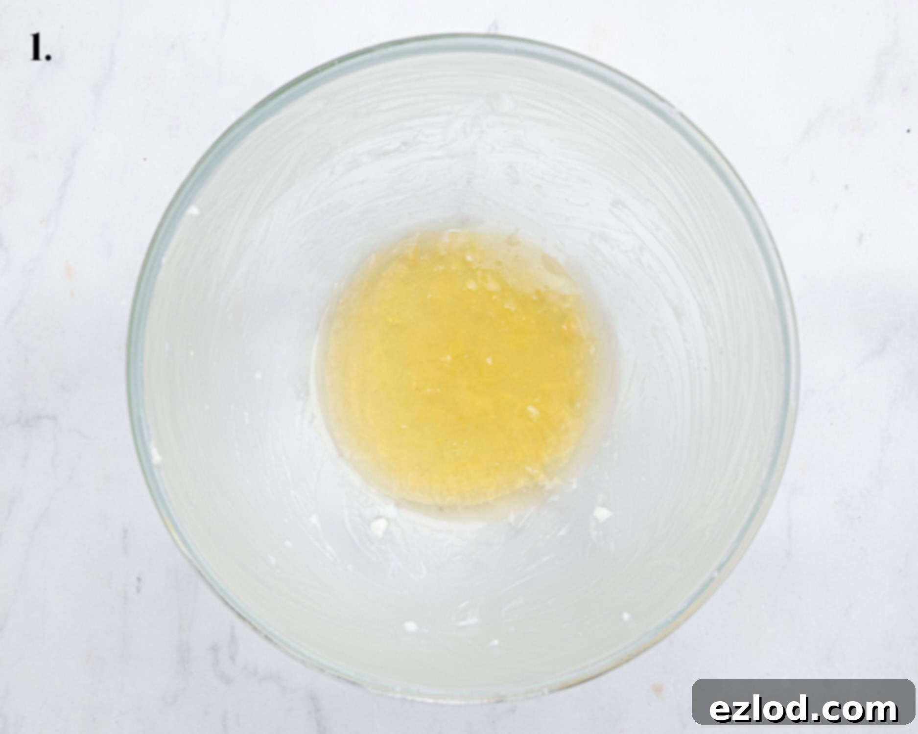 Vegan Microwave Syrup Pudding 5 Step 1, the greased bowl with golden syrup in the base.