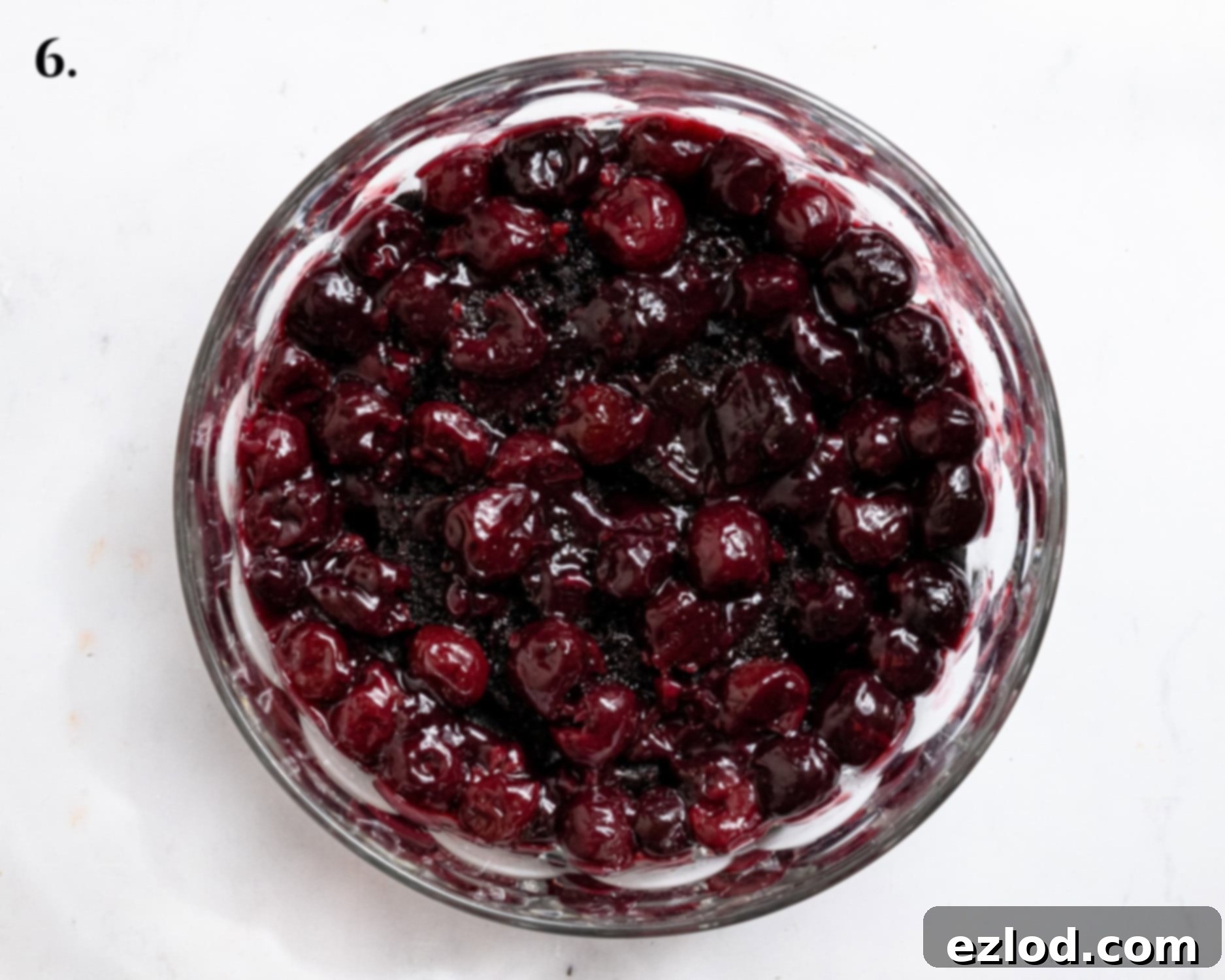 Vegan Dark Cherry Dream Trifle 10 Step 6, the cherry compote layer in the trifle dish.