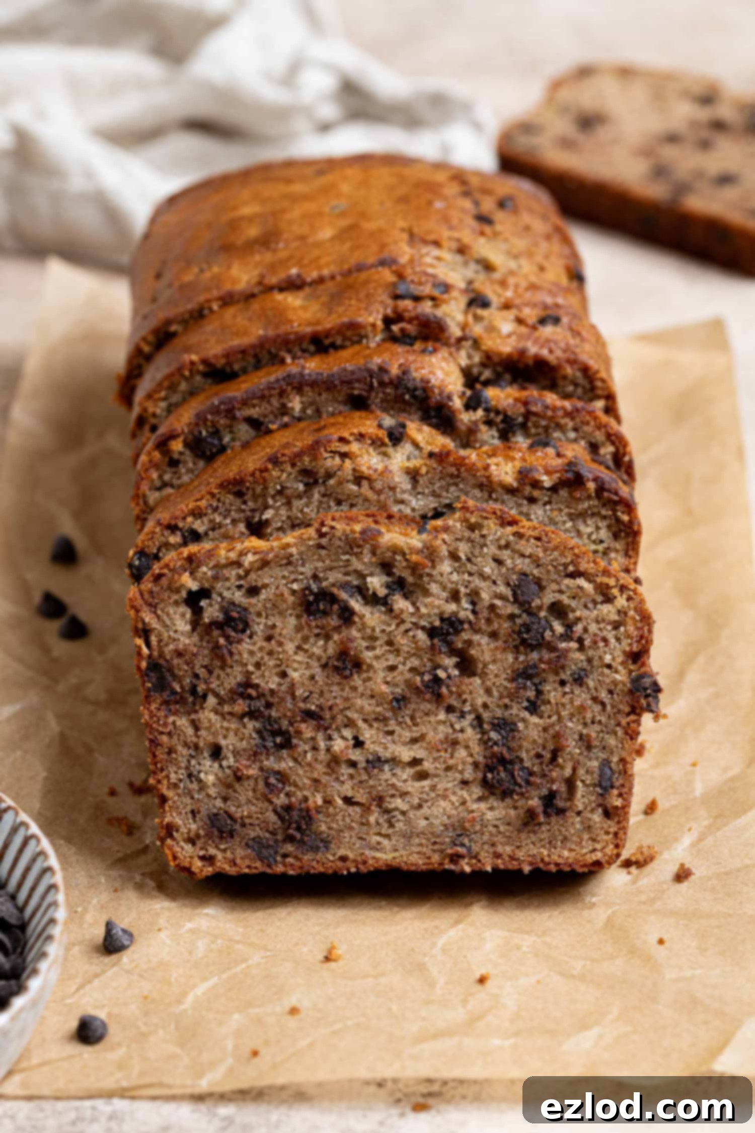 Slices of chocolate chip banana bread in a row.