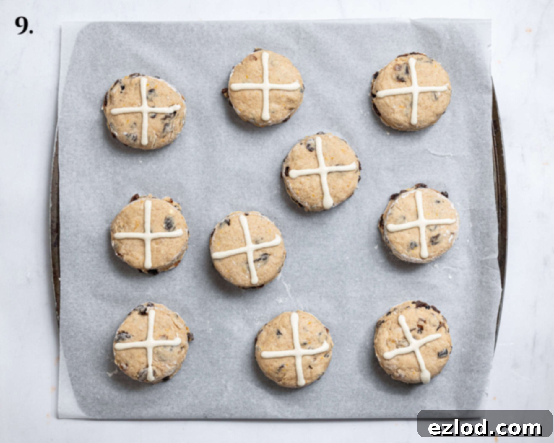 Scones with crosses piped on top.