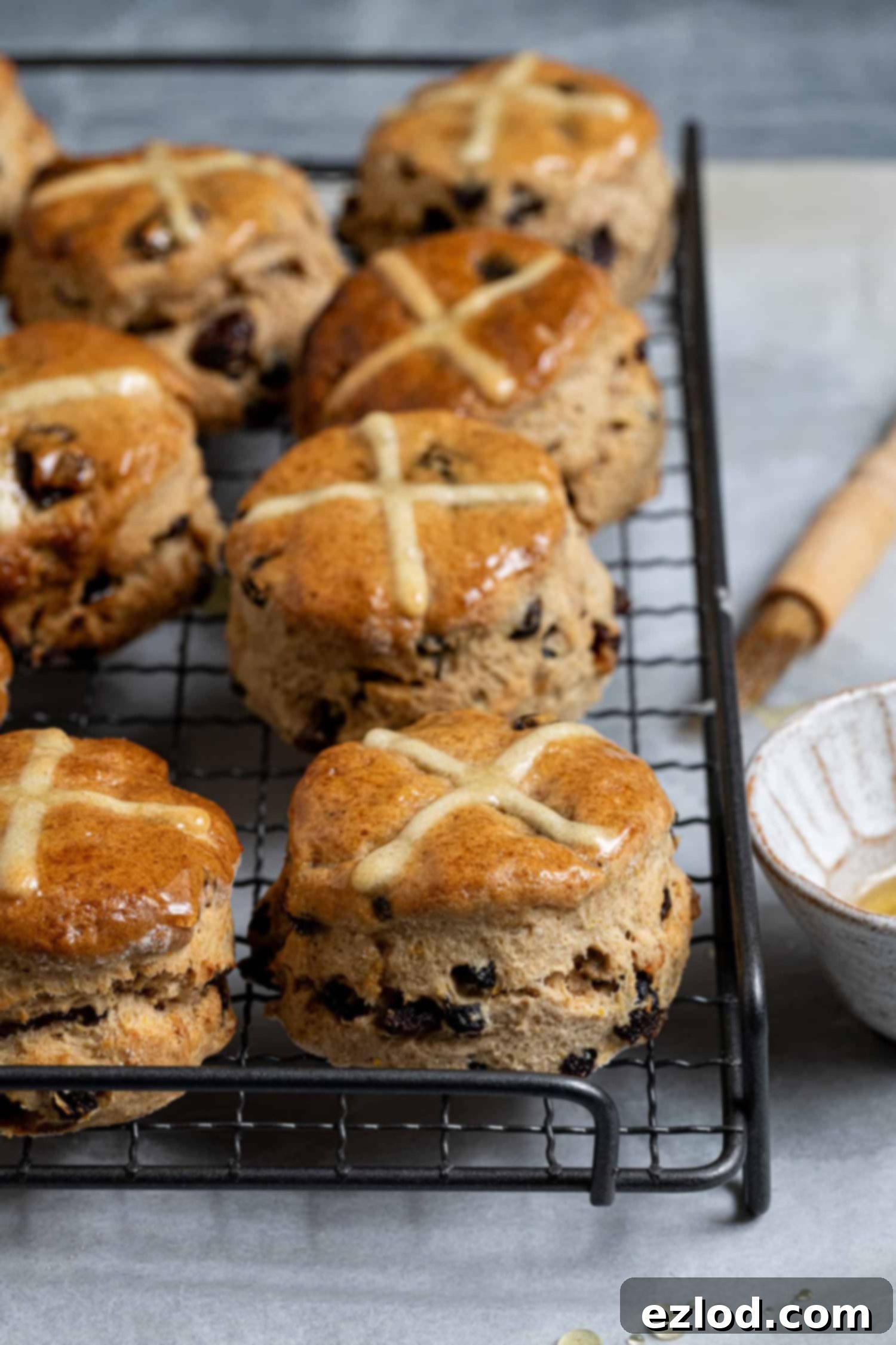 Vegan hot cross scones on a wire cooling rack.