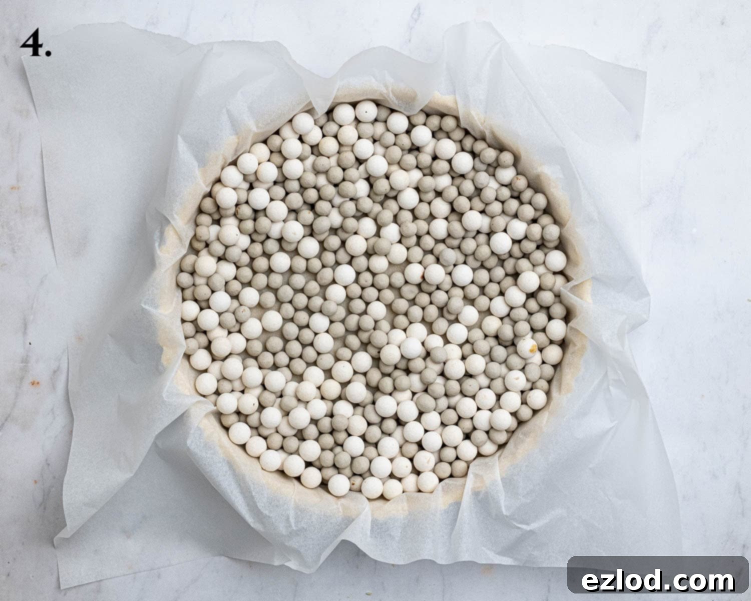 Pastry case filled with baking beans