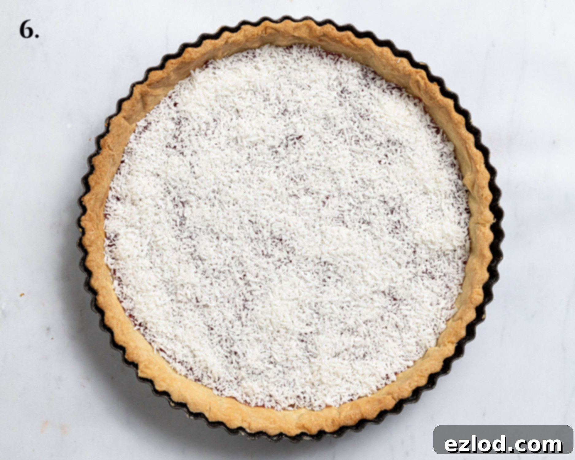 Pastry case with jam and coconut